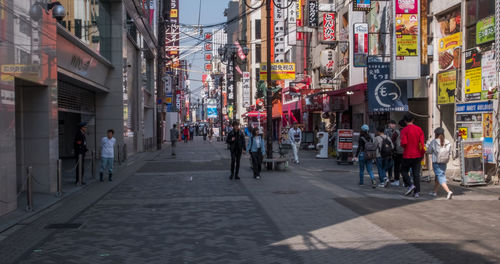 People walking on street in city