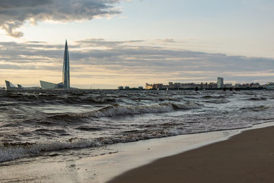 Scenic view of beach against sky during sunset