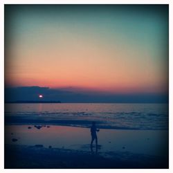 Scenic view of sea at sunset