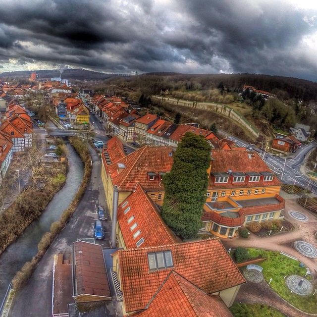 architecture, building exterior, built structure, cloud - sky, cloudy, sky, city, cityscape, high angle view, weather, cloud, residential district, residential building, residential structure, overcast, storm cloud, crowded, outdoors, travel destinations, water