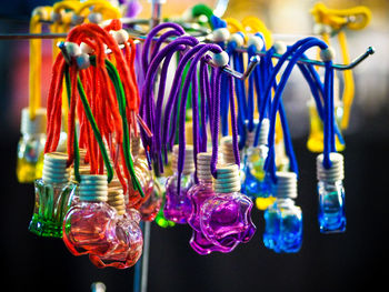 Close-up of multi colored decorations hanging at market stall