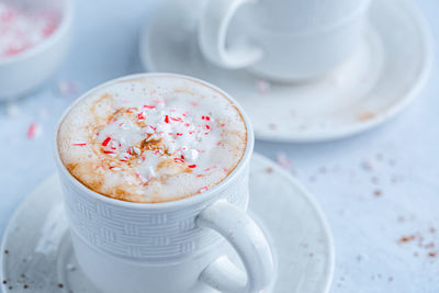 High angle view of coffee in cup on table