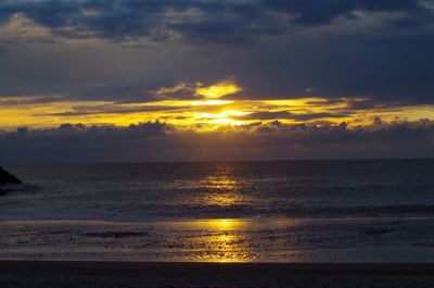 Scenic view of sea against dramatic sky