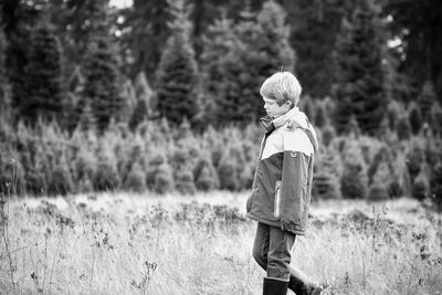 Rear view of child in forest