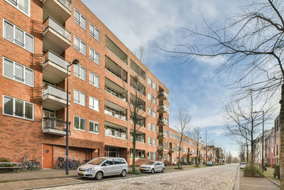 Street amidst buildings against sky