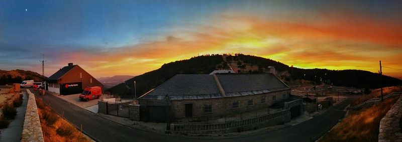 Panoramic shot of houses against cloudy sky