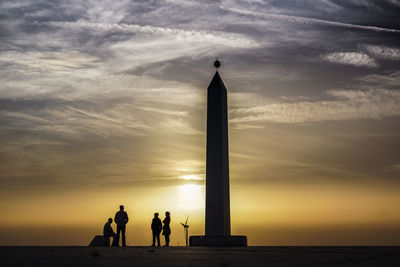 Silhouette people by sea against sky during sunset, halde hoheward