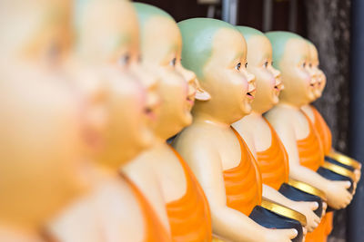 Close-up of monk statues