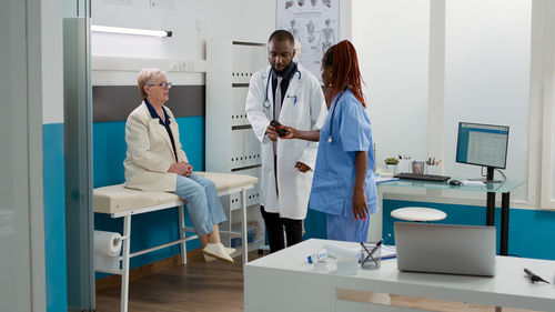 Female doctor examining chemical in laboratory