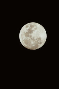 Low angle view of moon against sky at night