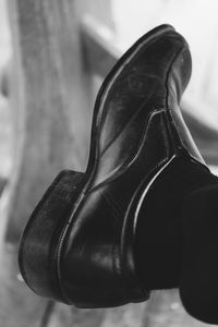 Low section of man wearing shoes