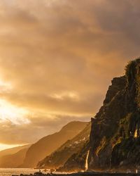 Scenic view of mountains against sky during sunset