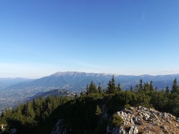 Scenic view of mountains against clear blue sky