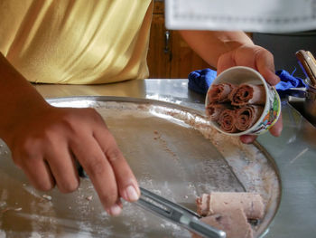 Midsection of woman preparing food