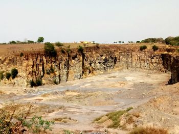 Scenic view of arid landscape against clear sky