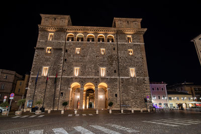 Low angle view of illuminated building at night