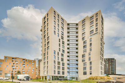 Low angle view of modern buildings against sky