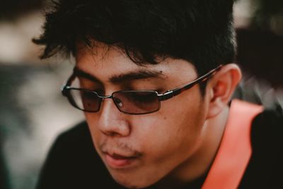 Close-up of young man with sunglasses