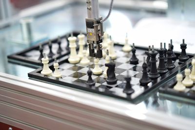 High angle view of chess pieces on table