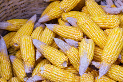 Close-up of corns in basket at market