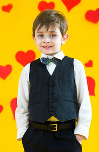 Boy 5 years old on a yellow background