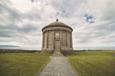 View of historical building against cloudy sky