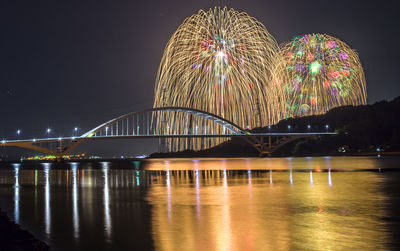 Illuminated ferris wheel at night