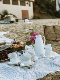 Coffee cups on picnic blanket 