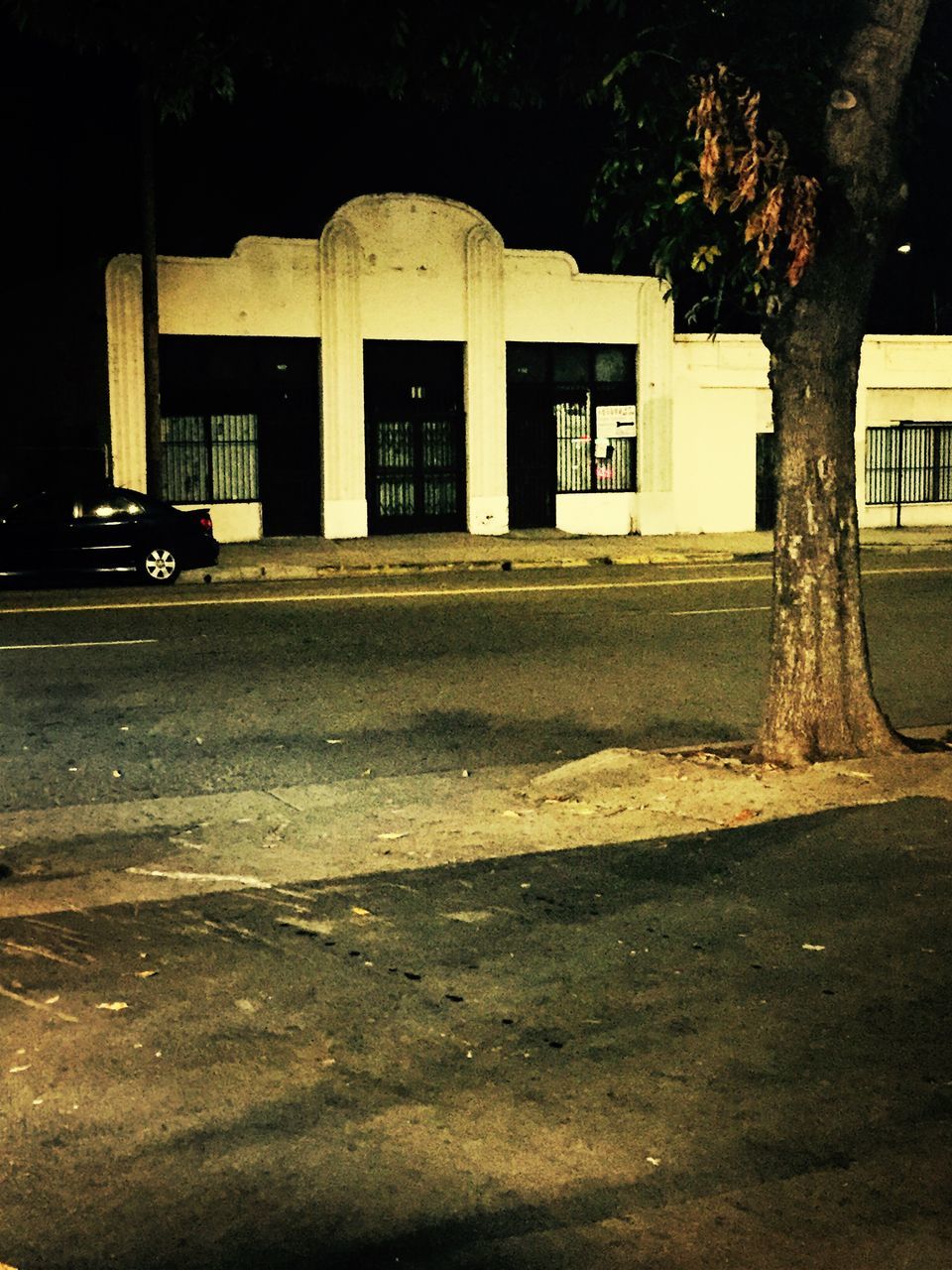 building exterior, architecture, built structure, night, street, house, tree, facade, building, road, residential structure, illuminated, residential building, outdoors, empty, door, city, no people, window, sidewalk