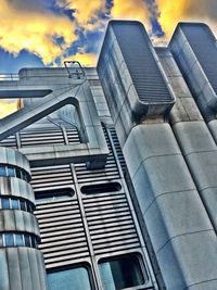 Low angle view of modern buildings against sky during sunset