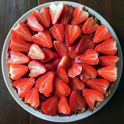 High angle view of strawberries in plate on table