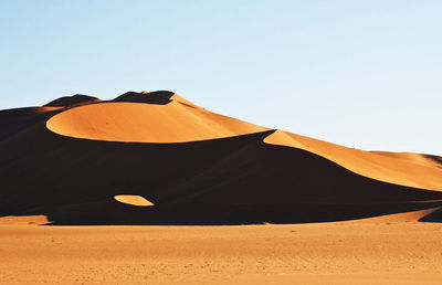 Scenic view of desert against clear sky