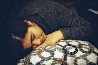 Close-up of woman sleeping on bed