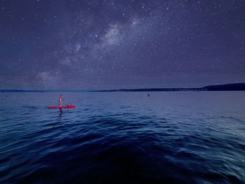 Scenic view of sea against sky at night