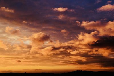 Low angle view of dramatic sky during sunset