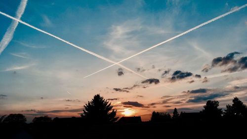 Low angle view of vapor trails in sky