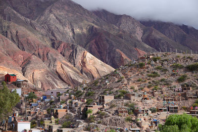 High angle view of townscape and mountains against sky