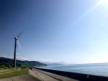 Scenic view of landscape against blue sky