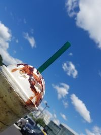 Close-up of ice cream against blue sky