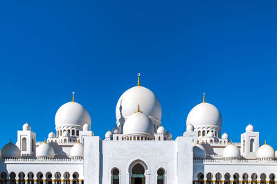 View of white building against blue sky