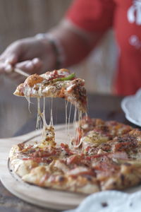 Cropped hand of person preparing food