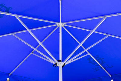 Low angle view of ceiling against clear blue sky