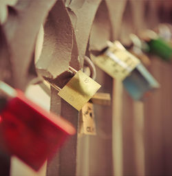 Close-up of padlocks hanging on metal