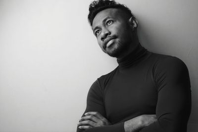 Portrait of young man against white background