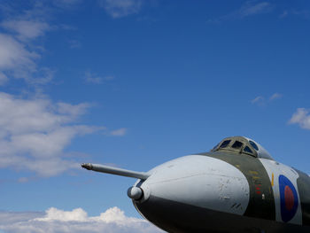 Low angle view of military airplane against sky