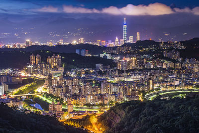 High angle view of illuminated buildings in city