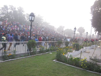 Crowd on field against sky