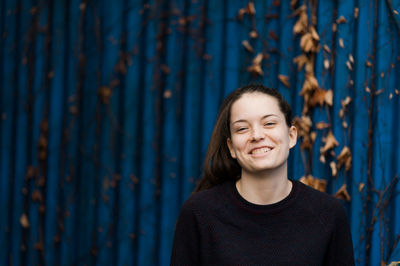 Close-up portrait of smiling woman outdoors