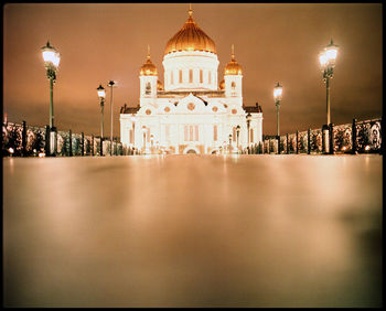 Illuminated buildings in city at night