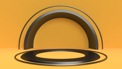 Close-up of illuminated lamp against wall